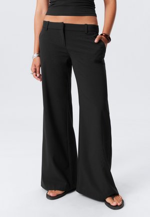 Weekday LOW FLARED SUIT - Tygbyxor - black