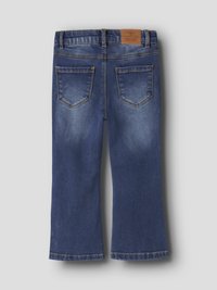 Denim-farkut, keskisininen väri, lahkeet lievästi levenevät alaosasta. Niissä on kaksi takataskua, kevyt haalistuma sekä ruskea nahkainen merkkilappu vyötäröllä.