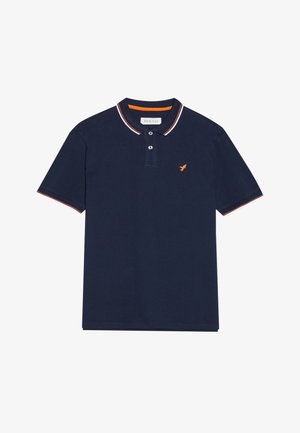 Polo shirt marine en coton, doté d'une patte de boutonnage à deux boutons, avec un col contrasté blanc et orange, et un logo orange sur la poitrine.
