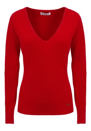 Pull rouge à col en V en tissu tricoté doux, avec des manches longues et des poignets côtelés, arborant un petit logo à l'ourlet.