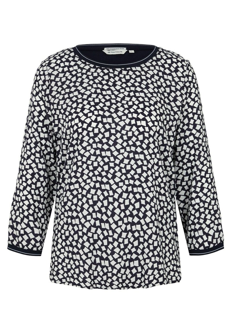 Granatowa, długosleeve jasna bluzka z geometrycznym białym wzorem, okrągłym dekoltem i teksturowanym materiałem z kontrastowymi mankietami.
