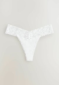 White lace thong with a floral patterned band, featuring scalloped edges and a smooth cotton base, designed for minimal coverage.