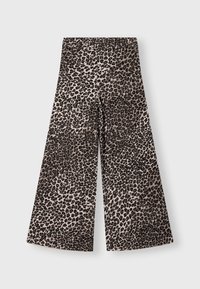 Pantalons larges en imprimé léopard beige et noir, avec une taille élastique et une texture douce. Design évasé, adapté à un look décontracté.