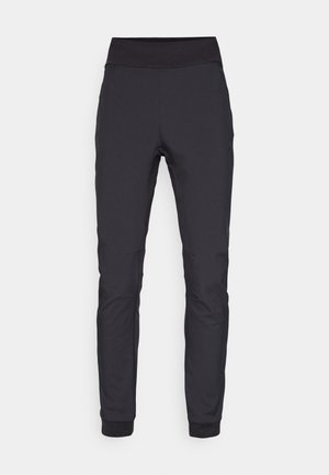 Zwarte sportieve broek van rekbaar materiaal, met een brede, gladde tailleband, taps toelopende pijpen en ribgebreide boorden bij de enkels.