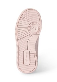 Suela de zapato de campeonato en suave goma rosa, con un patrón de textura en la banda de rodadura y un logo circular en el centro, diseñado para ofrecer tracción.