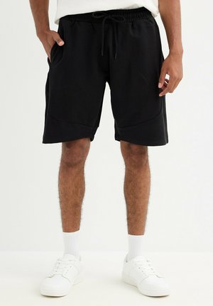 Pantalones deportivos - black