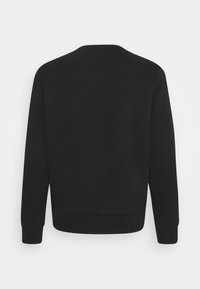 Sweat-shirt noir à manches longues avec poignets et ourlet côtelés, montré de dos sur un fond blanc uni.