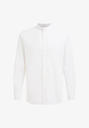 Valge nööbiga särk pehmest kangast, pikki varrukatega ja riba kaelusega. Õrn tekstuur, millel on õmblusdetailid ees.