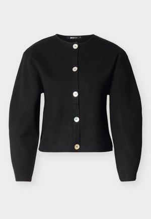 Black cardigan made of knit fabric, featuring a rounded neckline, long sleeves, and six large, metallic buttons down the front.