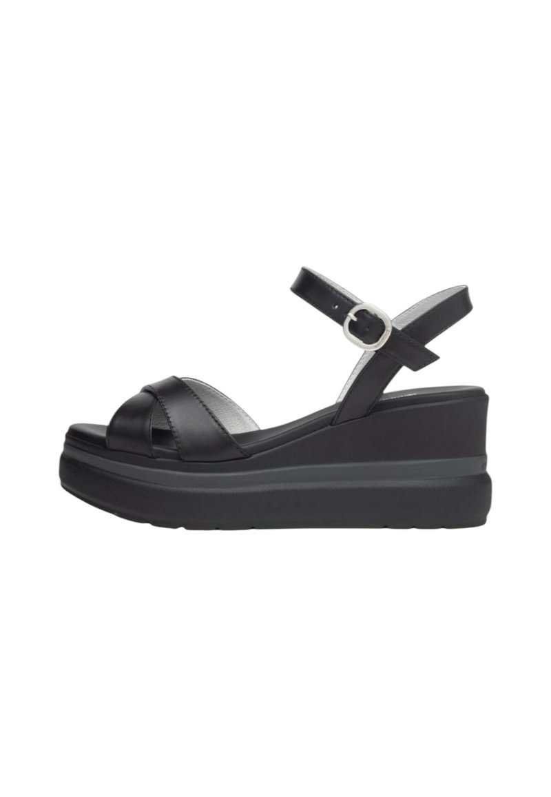 Sandali wedge neri in pelle con design a fascia incrociata, cinturino alla caviglia regolabile e suola piattaforma testurizzata. Presenta un accentuato con fibbia argentata.