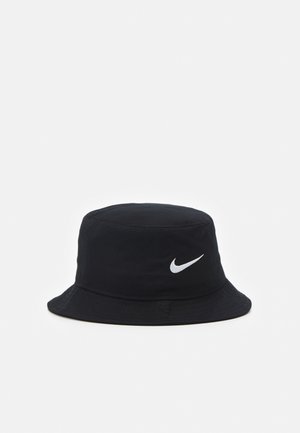 Black bucket hat made of lightweight fabric, featuring a white Nike logo on the front. Soft, round crown with a wide, downward-sloping brim.