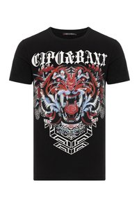 Schwarzes Baumwoll-T-Shirt mit einem großen roten und blauen Tiger-Graphic, das mit feinen Details versehen ist, sowie weißen geometrischen Mustern unter dem Design.
