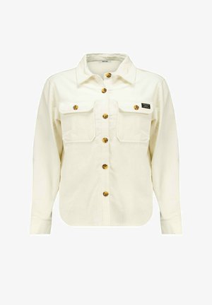 Weißes Cordhemd mit langen Ärmeln, Knopfleiste, zwei Brusttaschen und gelb-braunen Knöpfen. Verfügt über einen umgeschlagenen Kragen und ein Etikett-Detail.