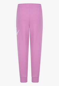 Ρόζ παντελόνια jogging από μαλακό μείγμα βαμβακιού. Έχουν ελαστική μέση και μανσέτες, με ένα λευκό λογότυπο στο αριστερό πόδι.