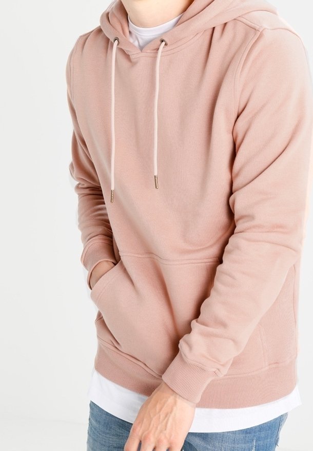 Sweat à capuche rose clair en mélange de coton, doté d'une poche avant, de cordons de serrage ajustables, de poignets côtelés et d'une texture douce.