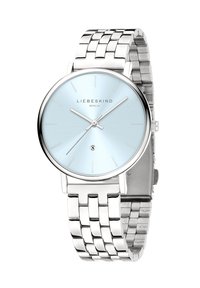 Zilveren roestvrijstalen horloge met een lichtblauwe wijzerplaat, minimalistisch ontwerp, dunne uurmarkeringen en een datumaanduiding op zes uur.