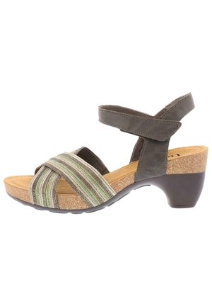 Sandale à talons pour femmes avec semelle en liège, bride de cheville marron et brides avant en croisillon rayées dans des tons de vert et de beige.