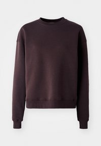 Mörklila sweatshirt gjord av mjukt, strukturerat tyg. Har en rundad halsringning, långa ärmar samt ribbade mudd och nederkant.