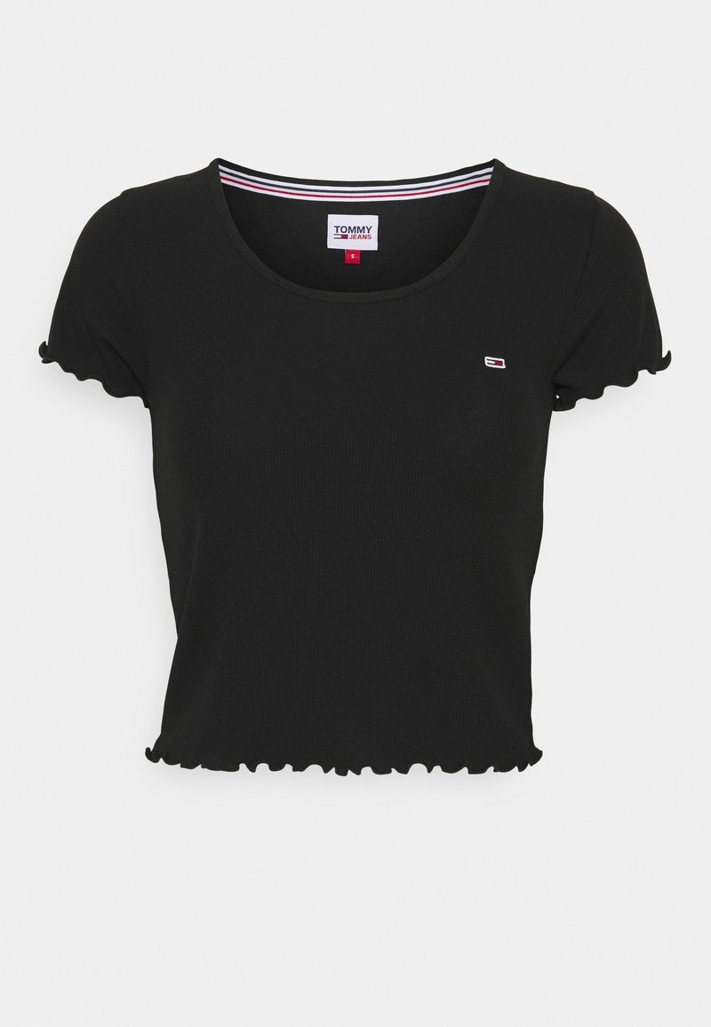 Svart ribbad kortärmad T-shirt med scallopkant på nederdelen och ärmarna. Har en liten logotyp på bröstet och en randig halsringning.