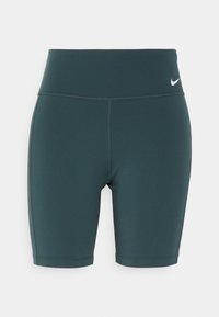 Tmavě tyrkysové cyklistické šortky s vysokým pasem z elastické látky, s plochým pasem a malým bílým logem na boku.