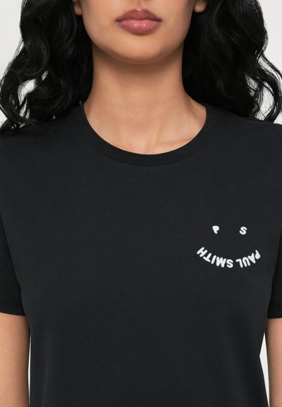Black cotton t-shirt with a round neckline. Features white embroidered text in a curved design on the left chest area. Short sleeves.