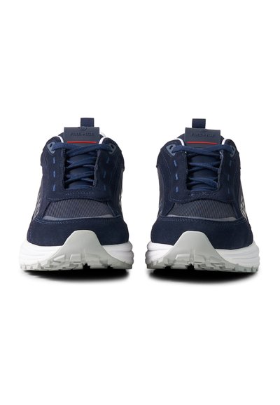 Pair of navy blue athletic shoes with white soles, mesh and suede details, and "FIRE+ICE" label on front pull tabs.