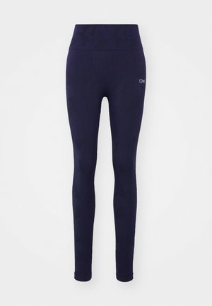 Leggings blu navy con vita alta, realizzati in tessuto elastico, caratterizzati da un motivo sottile e un piccolo logo sulla coscia sinistra.