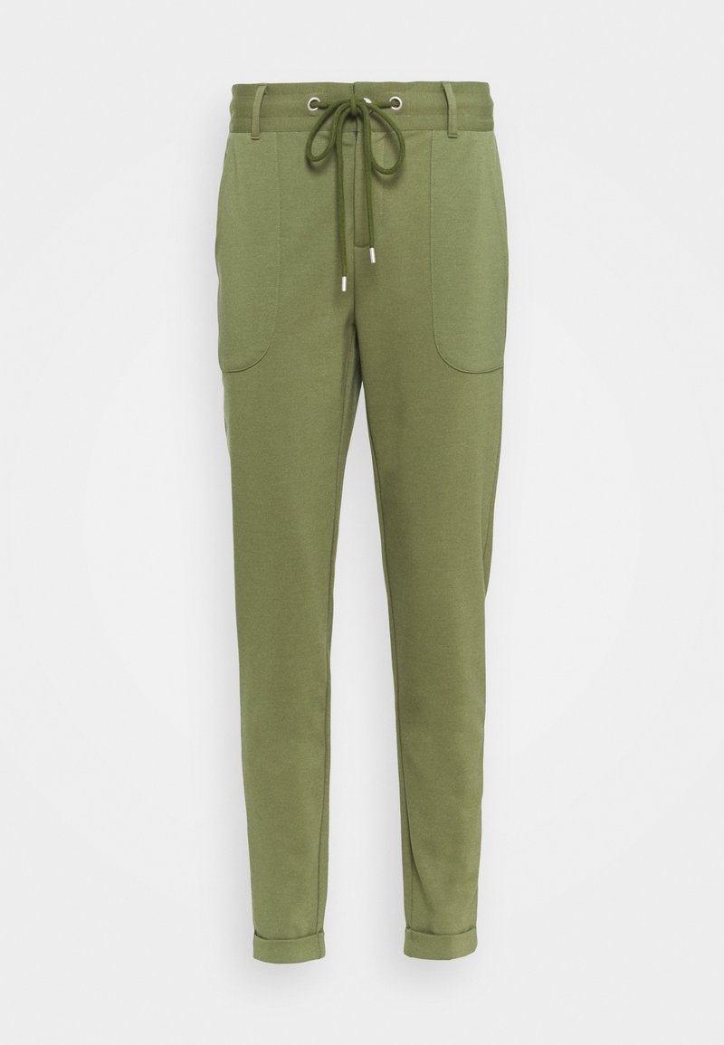 Pantaloni jogger verdi realizzati in materiale morbido, dotati di una vita con cordoncino, due tasche laterali e gamba affusolata con orli arrotolati.