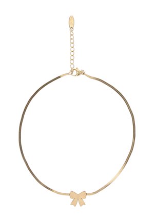 Finom aranylánc nyaklánc közepén egy kis masnira emlékeztető medállal és állítható kapoccsal, rövid lánchosszabbítóval.