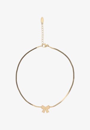 Finom aranylánc nyaklánc közepén egy kis masnira emlékeztető medállal és állítható kapoccsal, rövid lánchosszabbítóval.