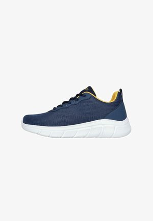 Scarpe da ginnastica in rete blu navy con accenti gialli, dotate di una suola bianca ammortizzata e design con lacci, ideali per comfort e traspirabilità.
