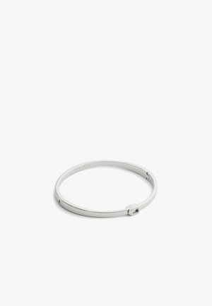 Silver metal bangle bracelet featuring a smooth, circular design with a simple fastening mechanism and engraved brand logo.