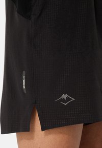 Black athletic shorts with a lightweight texture, featuring a mesh pocket, side slits, and a reflective logo. Includes "ACTIBREEZE" label.