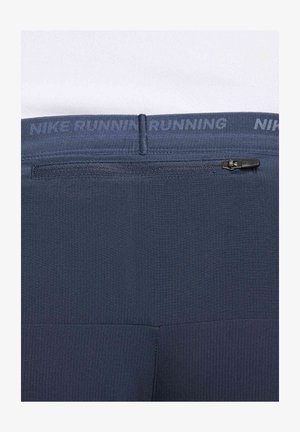 Leggings de course Nike en bleu foncé avec une finition texturée. Comprend une poche zippée dissimulée et une ceinture avec le logo "NIKE RUNNING".