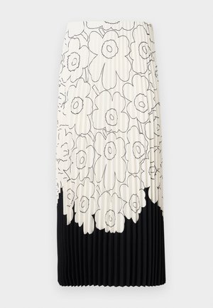Pleated skirt with a floral black and white pattern, featuring a light top half with flowers and a solid black bottom hem.