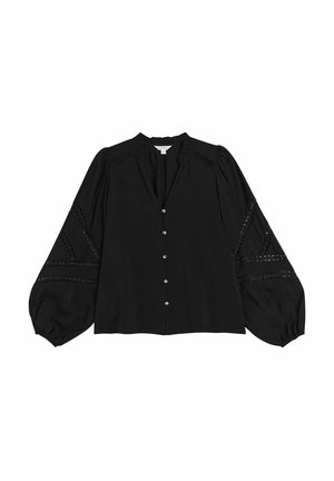 Blouse noire à manches longues avec des bordures en dentelle décoratives sur les manches, des boutons sur le devant et un petit col volanté.