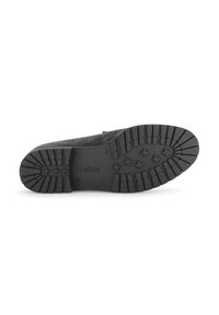 Black rubber shoe sole with textured tread pattern and logo. Features ridged edges and evenly spaced grooves for traction.