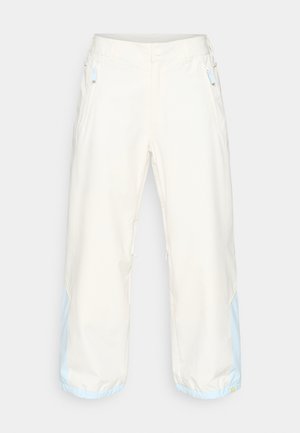 Svijetlosmeđi hlače širokog kroja s glatkom teksturom, s plavim naglascima na rubovima i bočnim patentnim džepovima. Lagani materijal.