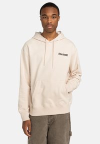 Hoodie crème avec une poche kangourou à l'avant, une capuche à cordon de serrage et un logo "Element" noir sur la poitrine. Tissu en mélange de coton doux.