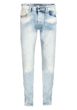 Light blue denim jeans with a faded finish, five pockets, zip fly, and a slim fit design. Features contrasting stitching along the seams.