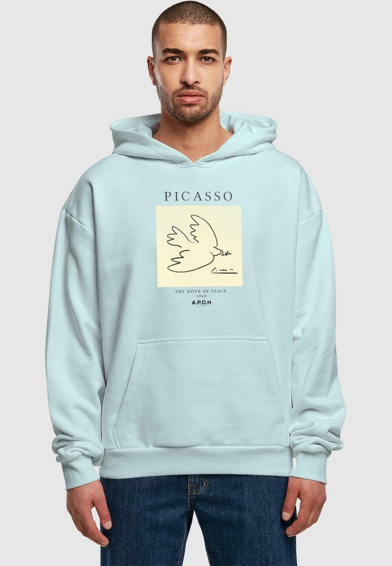 Lys blå hættetrøje med et frontgrafikdesign med en due, teksten "PICASSO," og "THE DOVE OF PEACE 1949." Blødt stof, kengurulomme.