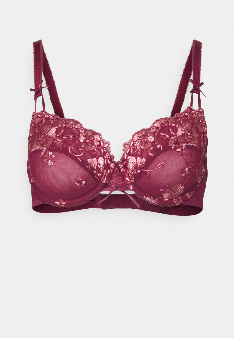 Burgundy bra with floral lace detailing, sheer mesh cups, adjustable straps, and decorative cross-straps at the center front.