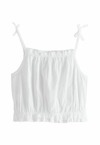 White cropped tank top with adjustable tie straps, gathered texture, and ruffled hem. Made from lightweight fabric.