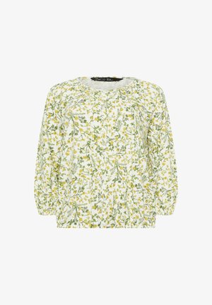 Blouse blanche à manches longues avec imprimé floral vert et jaune, col rond, boutonnière avant et poignets élastiques.