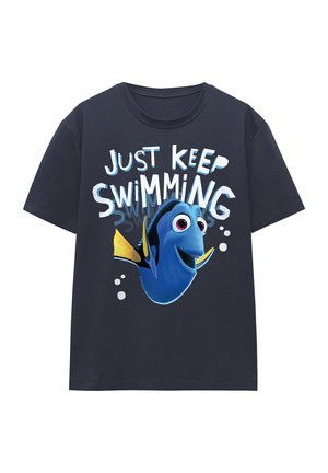 Dark navy t-shirt featuring a graphic of a blue fish with a yellow fin and large eyes, text "Just Keep Swimming" in white letters.