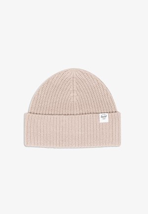 Knit beanie hat in light beige with a folded cuff, featuring a small brand label. Made of soft fabric with a textured pattern.