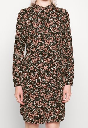Long-sleeve, buttoned floral dress with pink and white flowers on dark green background, worn by person shown from neck to knees.