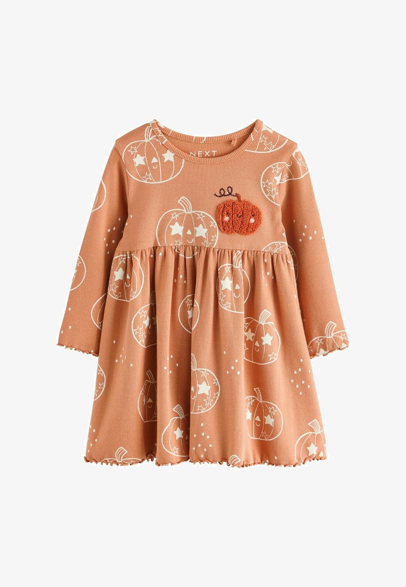 Orange långärmad klänning för småbarn med vita leende pumpa-tryck och en texturerad orange pumpa-flik på bröstet.