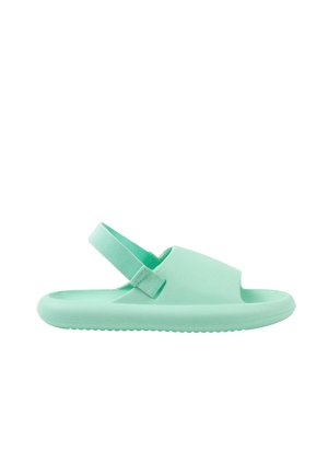 Sandalia abierta de color verde claro con suela gruesa y tira elástica ajustable en el talón, diseñada para comodidad y uso casual.