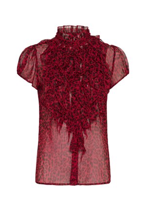 Punainen läpikuultava pusero mustalla leopardikuviolla, lyhyet puffihihat, korkea röyhelökaulus ja valuvat eturöyhelöt.